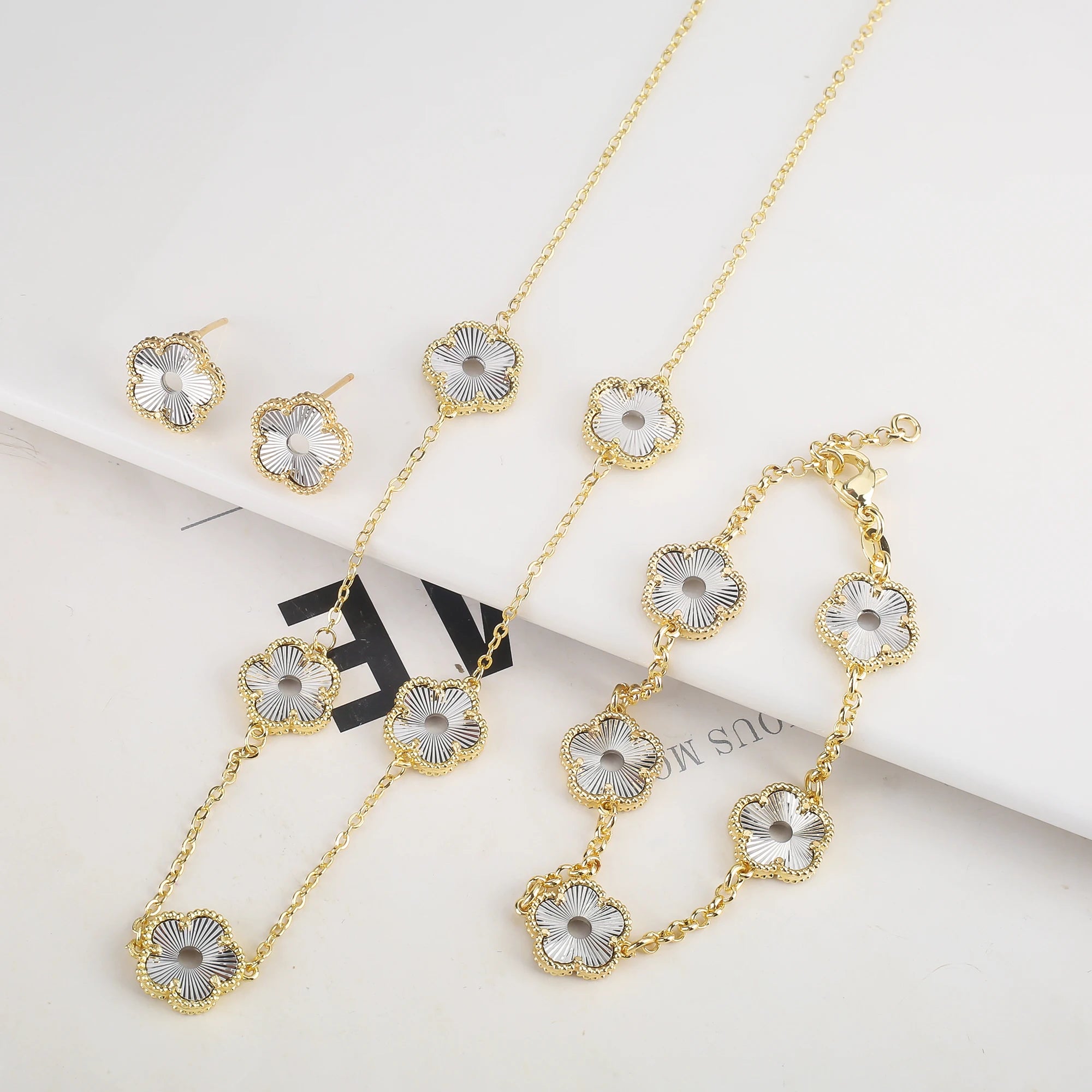Hollow Metal Double sided Hollow Jewelry Set Sparkling Hot Selling Plum Blossom Jewelry Set Creative New Design For Women Clover