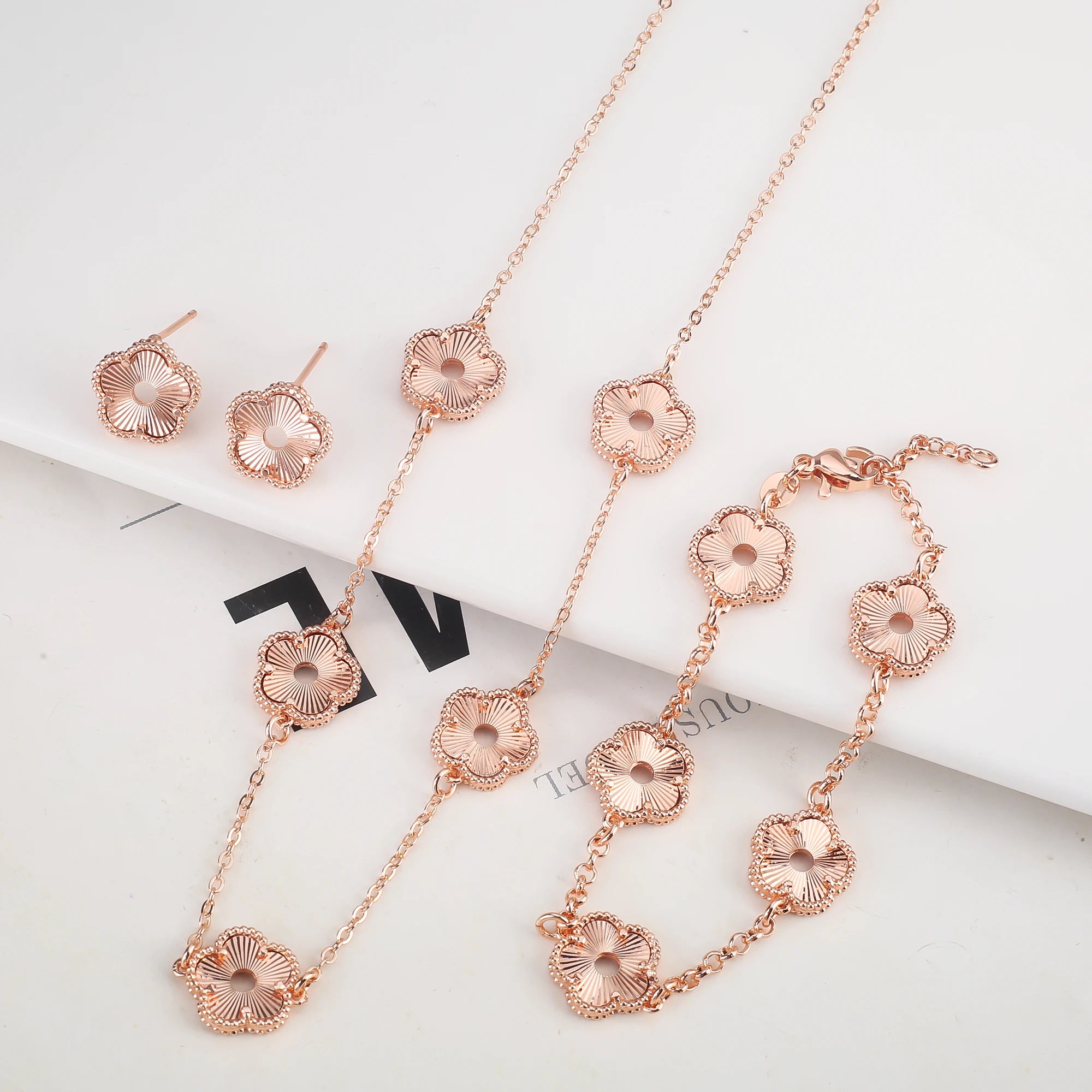 Hollow Metal Double sided Hollow Jewelry Set Sparkling Hot Selling Plum Blossom Jewelry Set Creative New Design For Women Clover