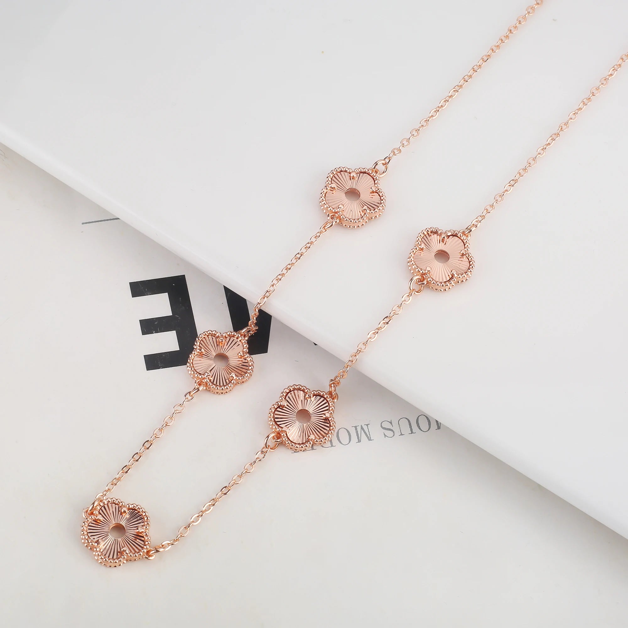 Hollow Metal Double sided Hollow Jewelry Set Sparkling Hot Selling Plum Blossom Jewelry Set Creative New Design For Women Clover