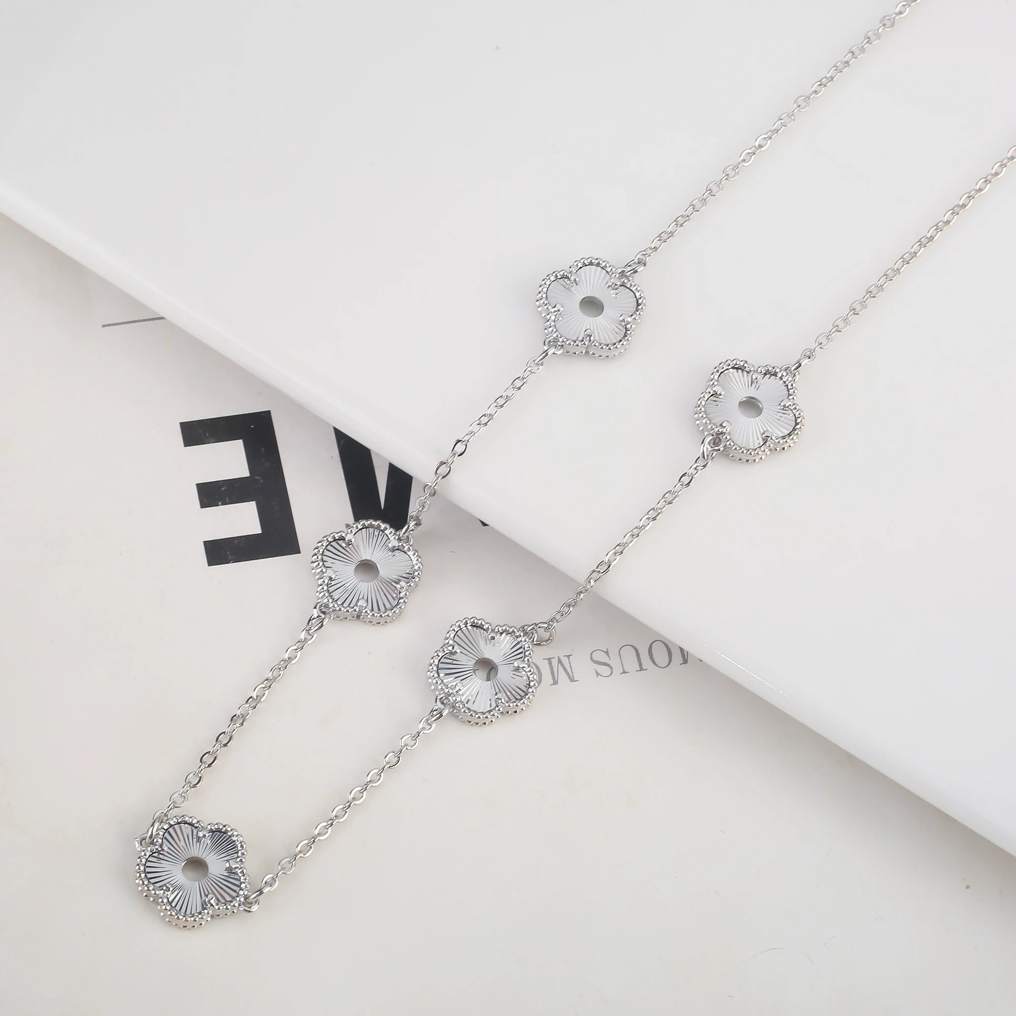 Hollow Metal Double sided Hollow Jewelry Set Sparkling Hot Selling Plum Blossom Jewelry Set Creative New Design For Women Clover