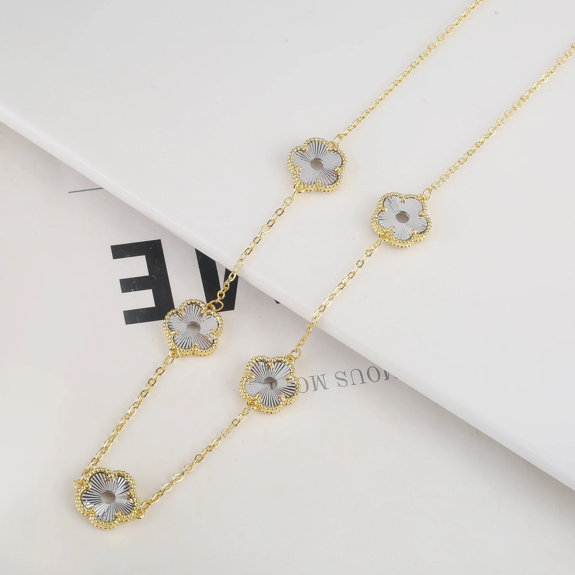 Hollow Metal Double sided Hollow Jewelry Set Sparkling Hot Selling Plum Blossom Jewelry Set Creative New Design For Women Clover
